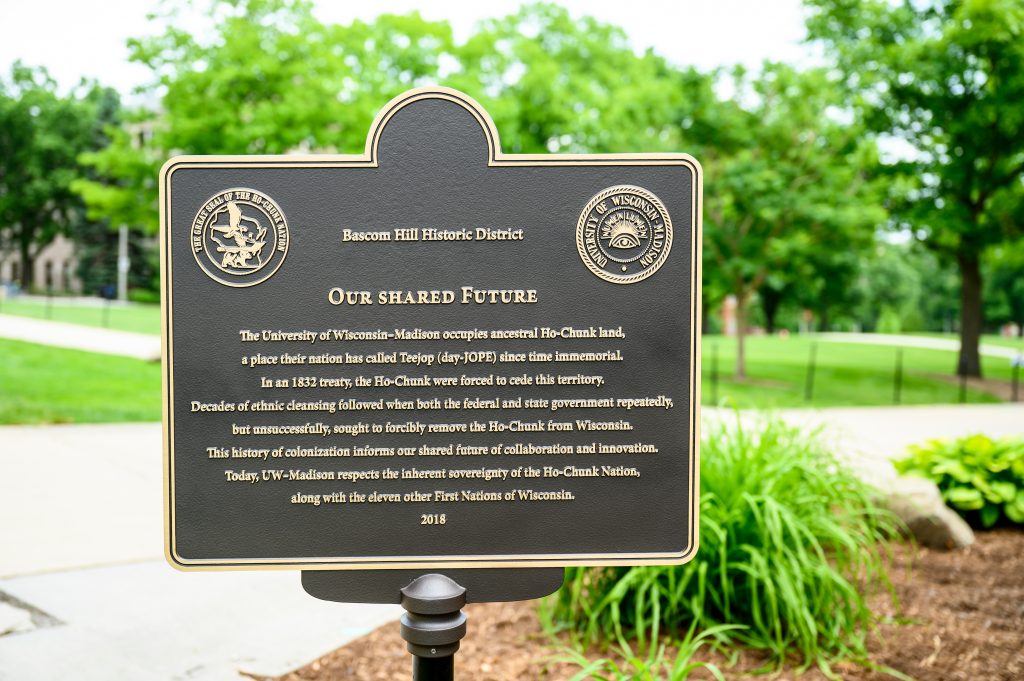 An "Our Shared Future" plaque, which makes clear that the university occupies ancestral Ho-Chunk land, is pictured on Bascom Hill at the University of Wisconsin-Madison on June 18, 2019.